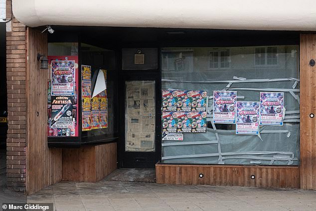 An empty store plastered with posters and newspaper. Locals said the town centre is strugglingRu
